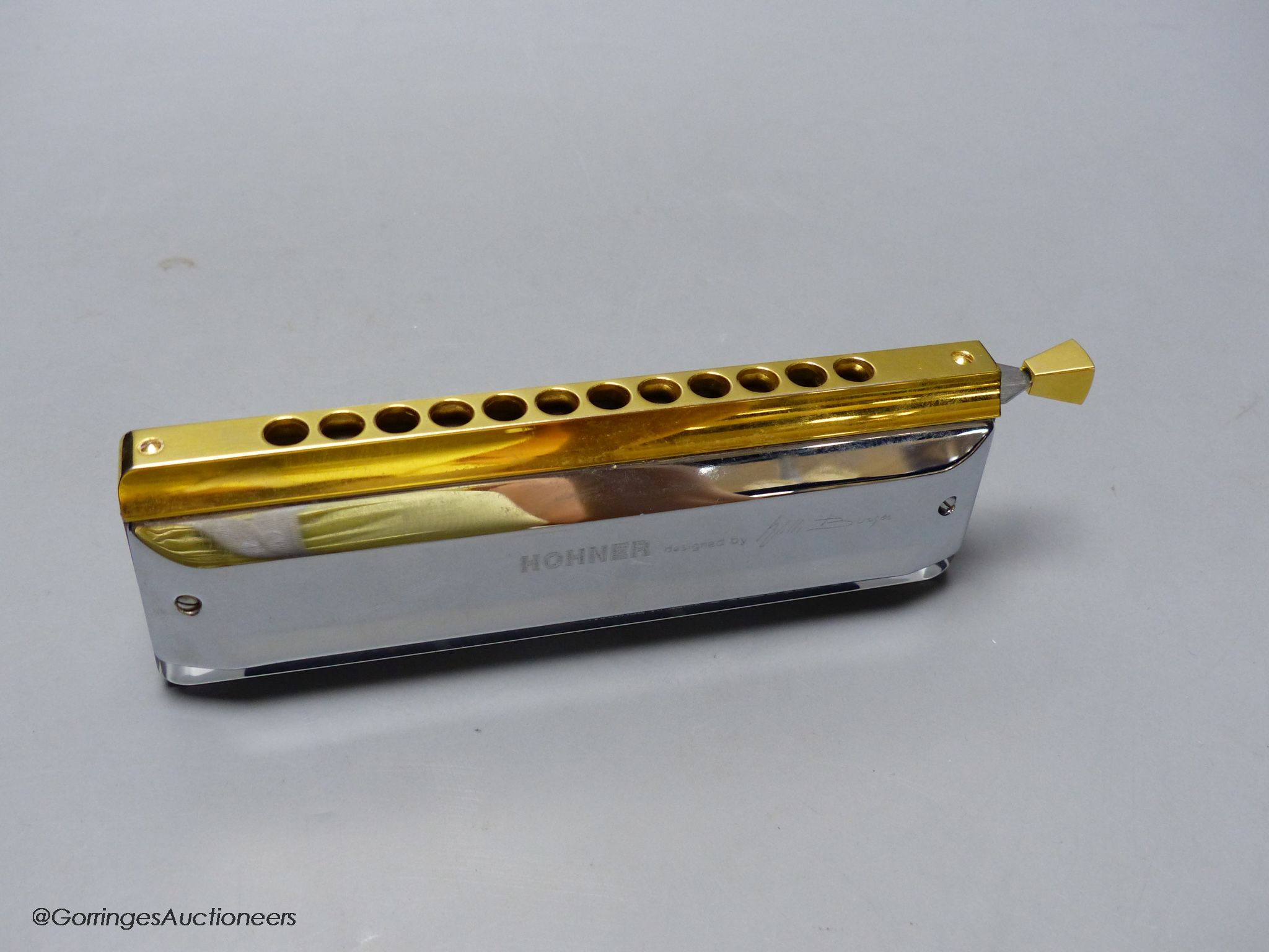 An M.Hohner Amadeus cased harmonica